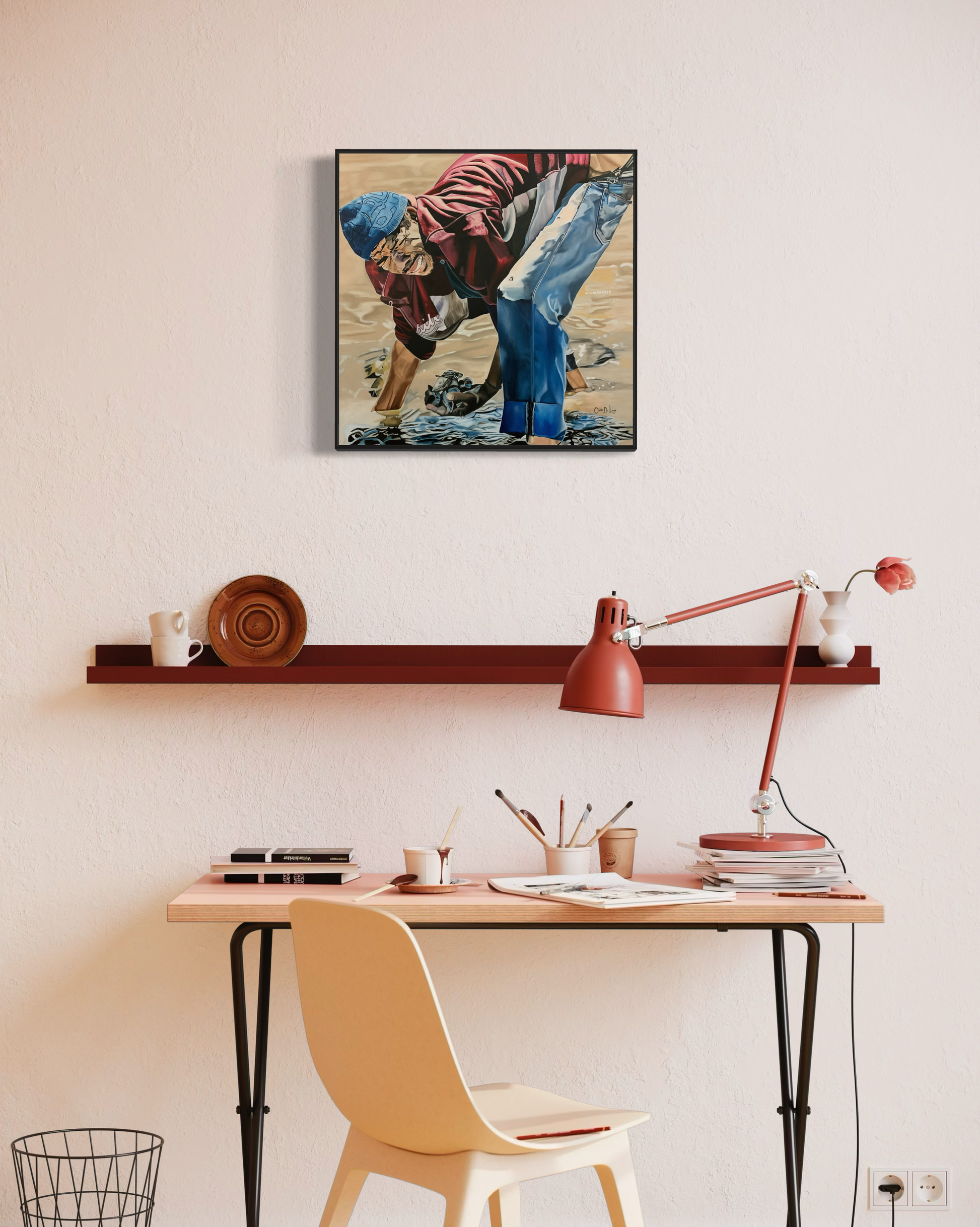 Modern home office with a desk, chair, lamp, and wall art of a man with his hand in shallow water, searching through the sand for oysters.