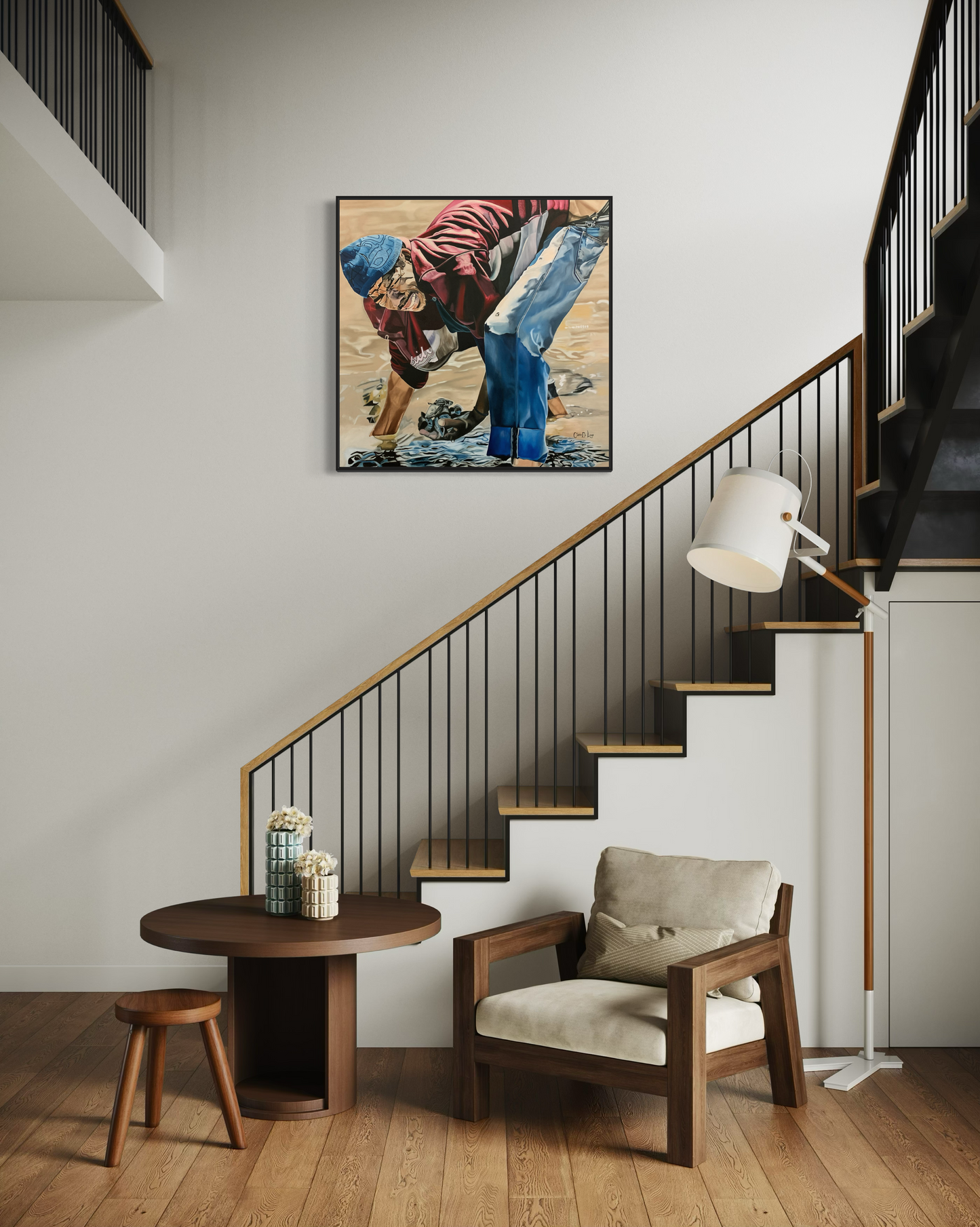 Modern interior with a staircase, chair, table, and artwork of a man harvesting oysters on the wall trying to make a living.