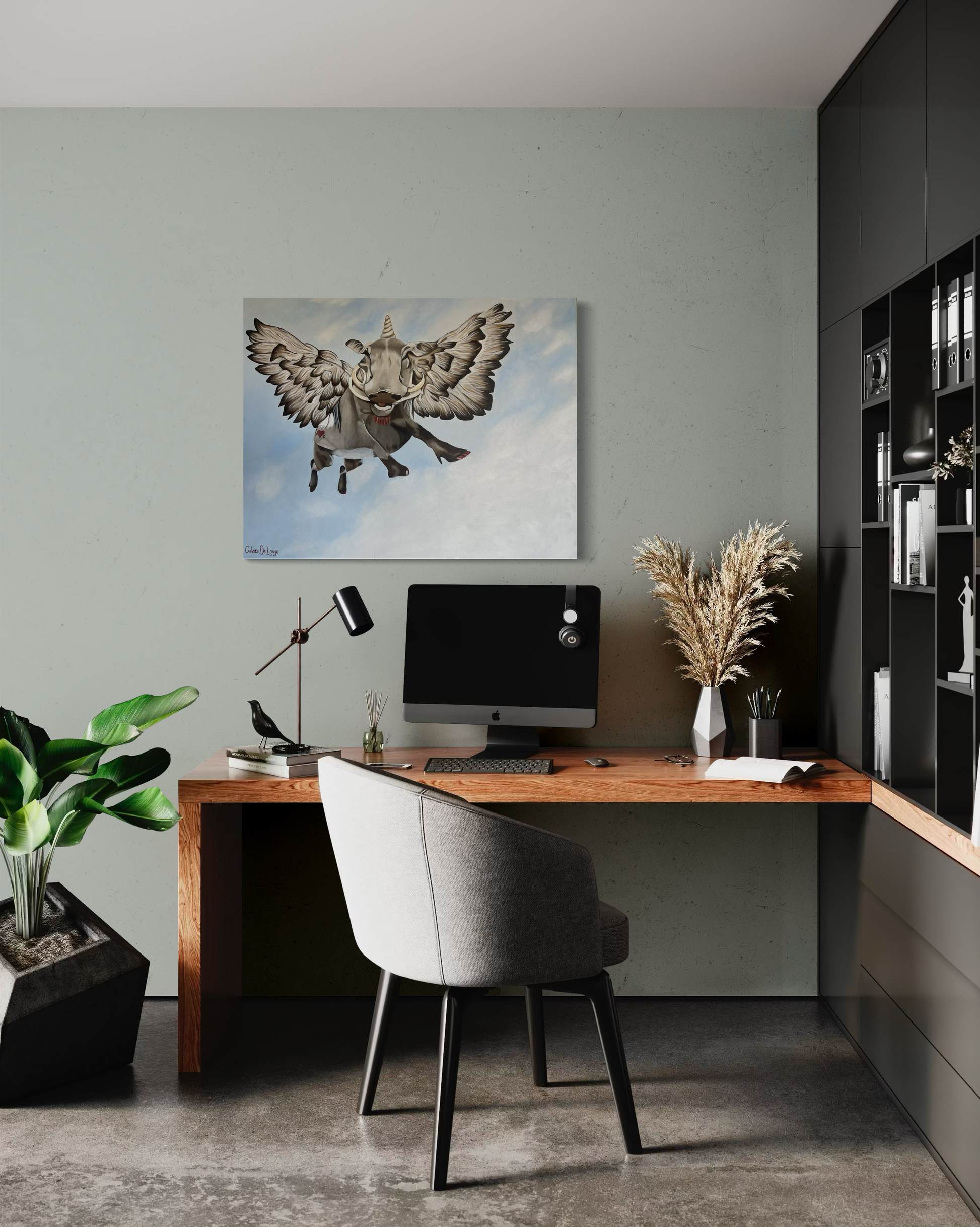 Modern home office with a wooden desk, chair, and decorative elements including wall art of a flying bushpig or warthog.